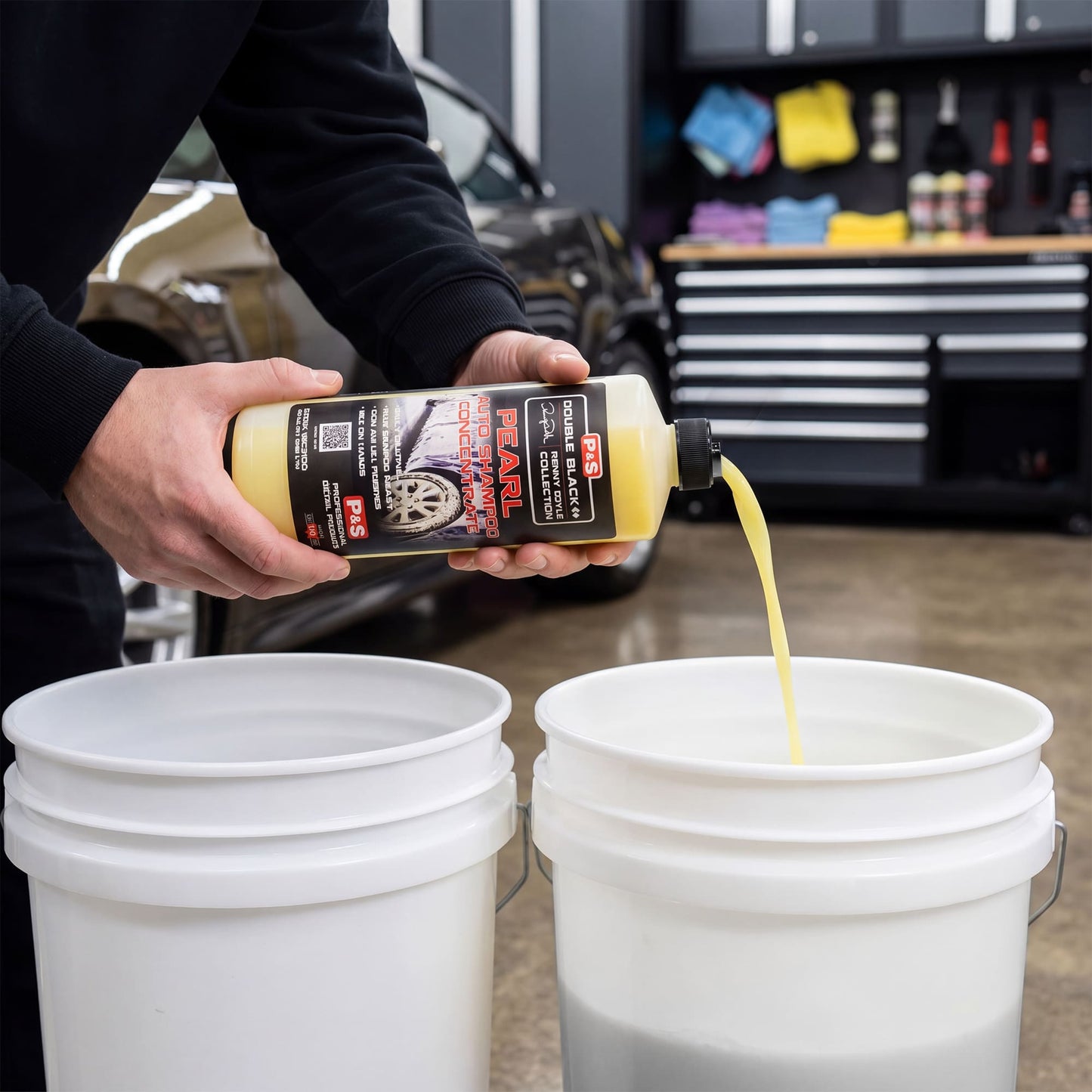 Detailer using P&S Pearl Auto Shampoo in two-bucket wash method