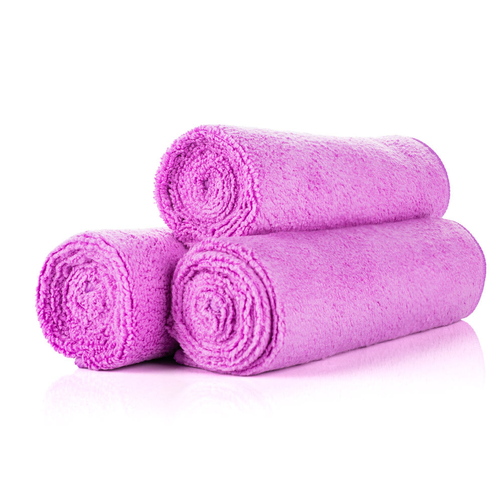 3 lavender towels rolled up