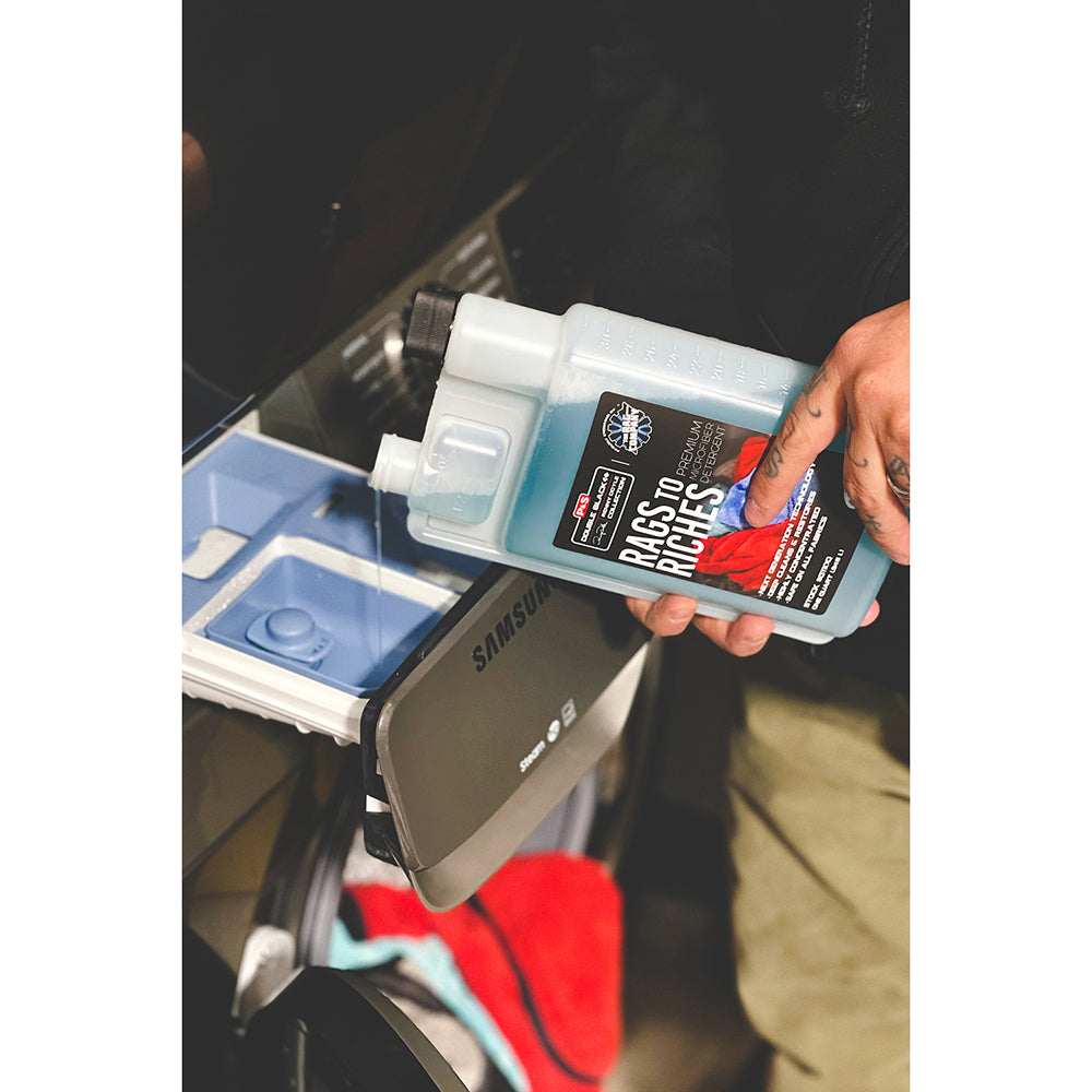 Detailer pouring P&S Rags to Riches into washing machine for microfiber load